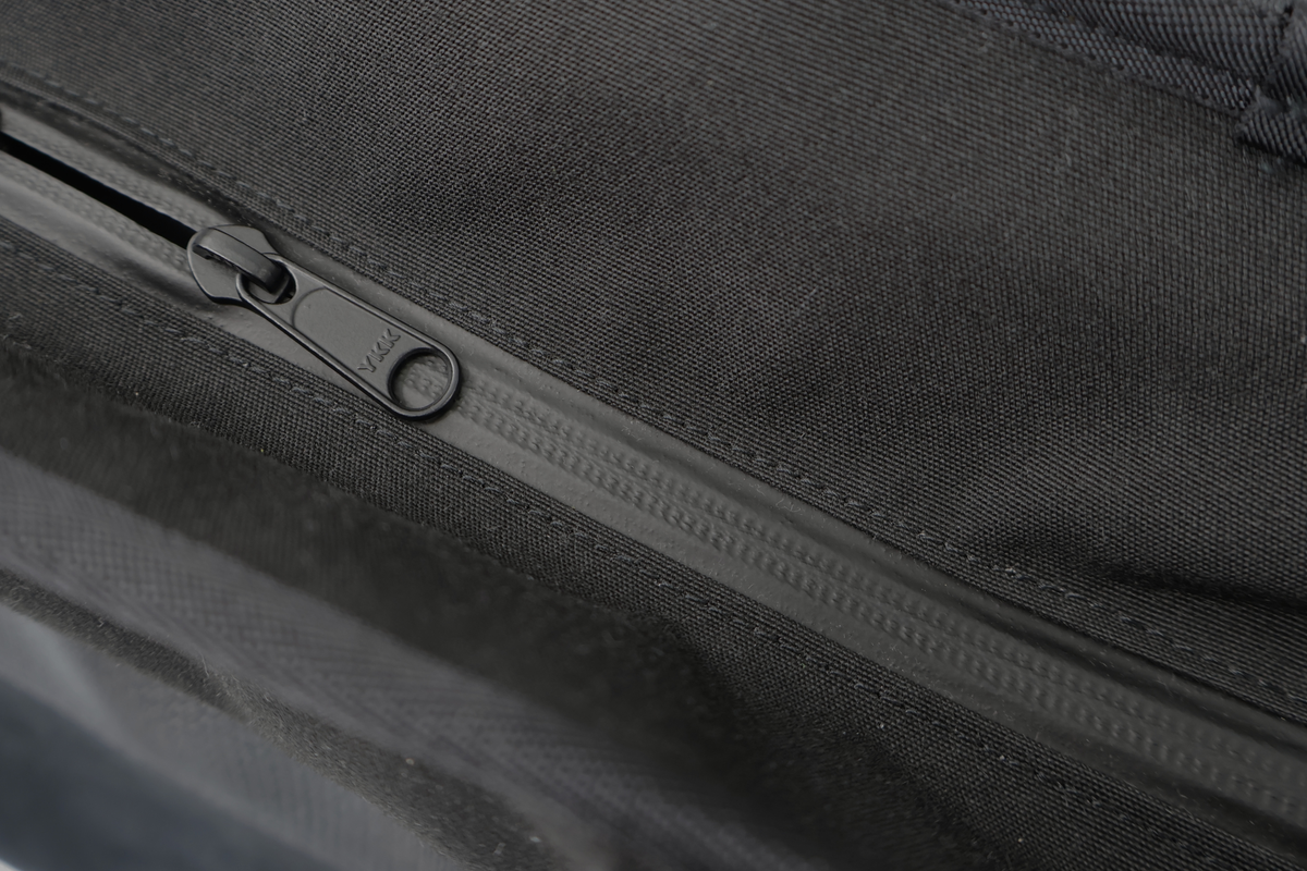 Equipped for rainy days, featuring tent fabric and water-resistant zippers.