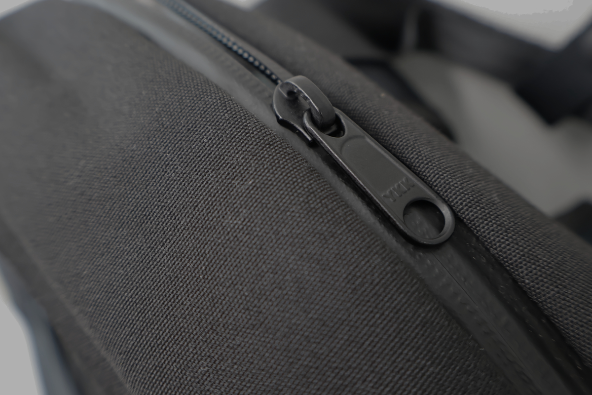 Equipped for rainy days, featuring tent fabric and water-resistant zippers.